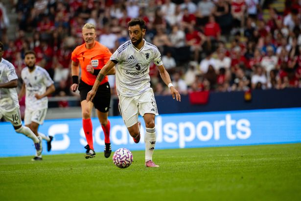 Bruno Fernandes drives forward with possession of the ball.