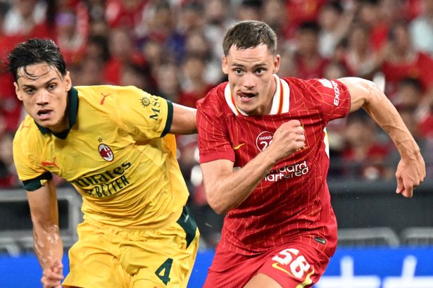Liverpool's Florian Wirtz is chased by AC Milan's Samuele Ricci during their friendly match at the Kai Tak Stadium in Hong Kong on July 26 2025