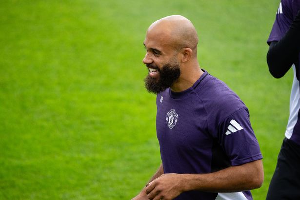 Bryan Mbeumo smiles during training for Manchester United.