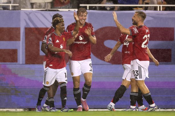 United players celebrate their third goal of the game