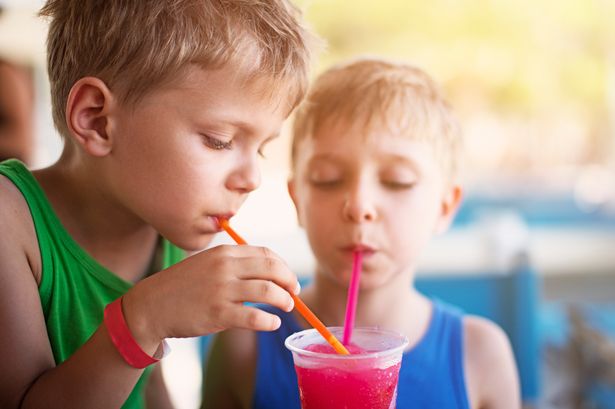 Two young boys with a blue slushie