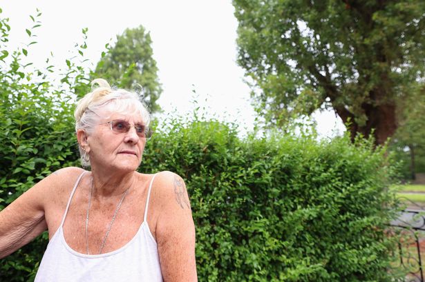 Gladys Bakken and her driveway which is being damaged by the roots of the trees on Lower House Road. Photo by Colin Lane