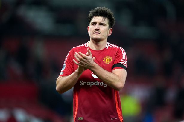 Manchester United defender Harry Maguire applauds 