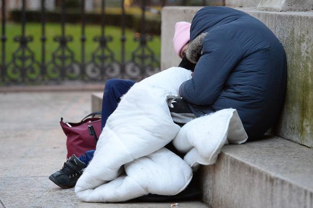 File photo of two homeless people sleeping rough