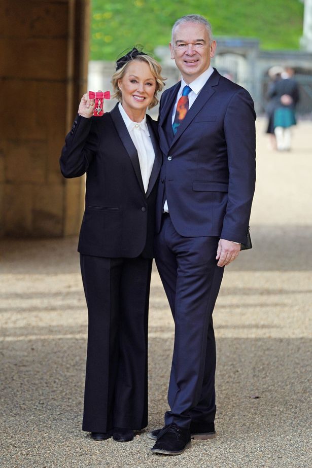 Coronation Street actress Sally Dynevor stands with her husband, Tim, after receiving her MBE (Officer of the Order of the British Empire) at an investiture ceremony at Windsor Castle on February 2, 2022