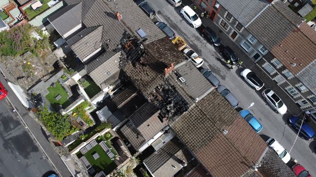 A drone picture of a property which has been damaged