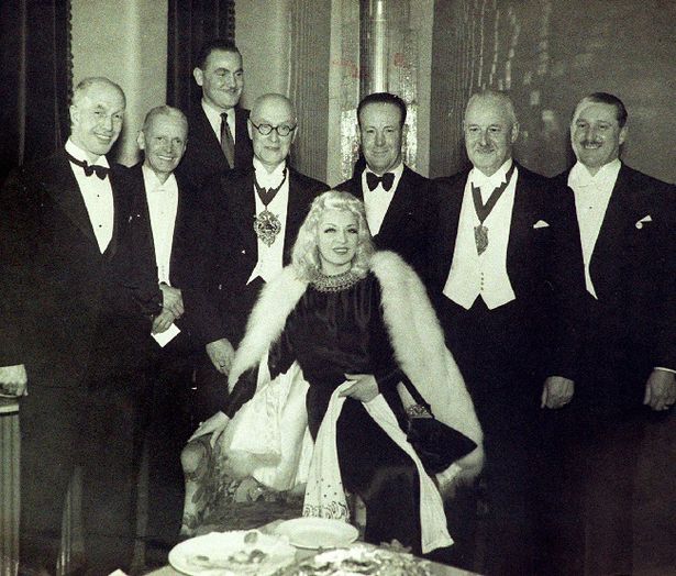 Movie star Mae West with dignitaries during a visit to New Brighton at the opening The Grand Hotel