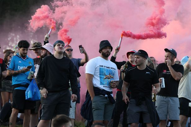 Oasis fans have set off flares outside Heaton Park