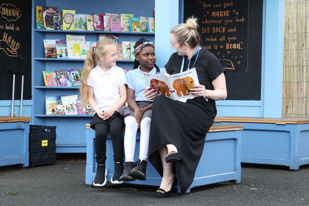 Pupils enjoy a story at the Monsall school 