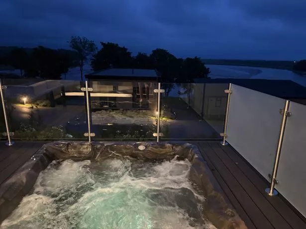 Light up hot tub at night at Dylan Coastal Resort, Laugharne