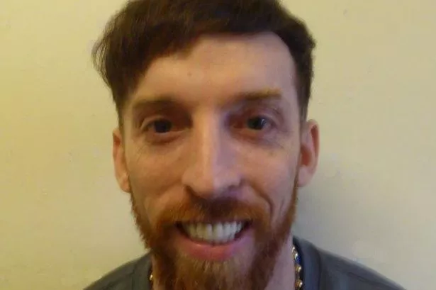 Drug and gun trafficker Leon Cullen, from Warrington, smiles in a police mugshot