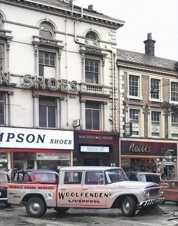 The entrance to the Masquerade Club in between Timpsons and Neills.