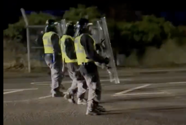 Police with shields on the night