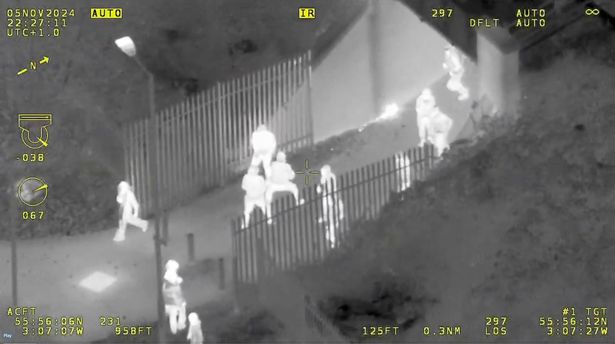 Helicopter footage showed youths throwing fireworks 