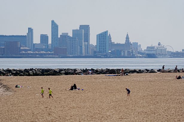 People enjoy the warm weather on New Brighton beach