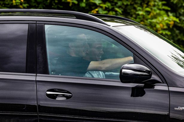 Ben Davies (L) and Kieran Dowell (R) arrive for Rangers' pre-season training