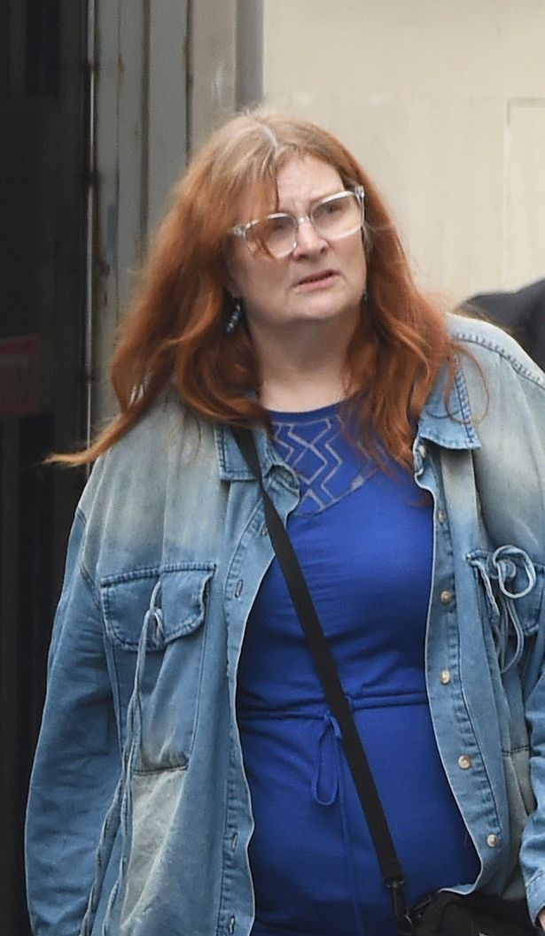 Ruth Jennings pictured at court in Derry with glasses, long grey, ginger hair and wearing denim jacket and blue top 