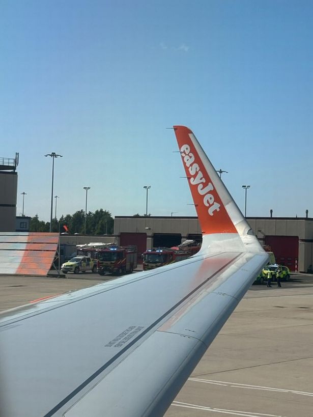 Emergency services inspect an engine on an easyJet flight after it returned to Liverpool airport 