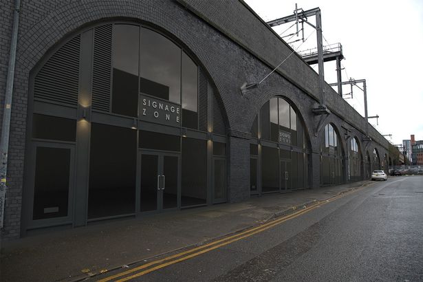 Restored railway arches on Norton Street in Salford.