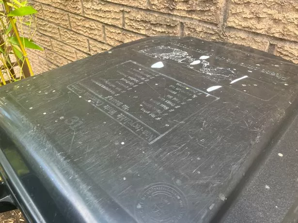 The material has landed on bins and windows.