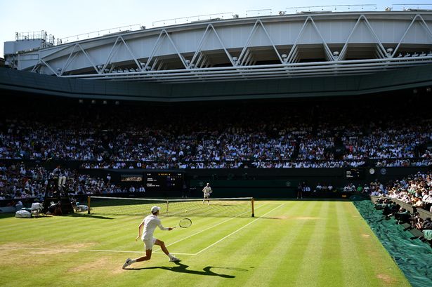 A general view over Centre Court as Jannik Sinner plays a forehand against Novak Djokovic
