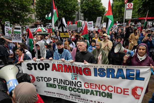 Protesters demanding a ceasefire and an arms embargo against Israel march in London.