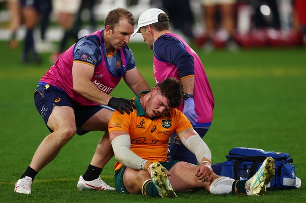  Carlo Tizzano of the Wallabies receives medical attention