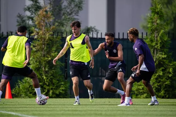 Mason Mount, Noussair Mazraoui of Manchester United in action during a first team training session