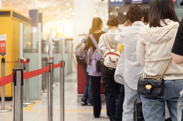 Passengers lined up at the airport 