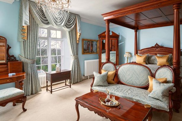 One of the 'sumptuous bedrooms' at Plas Dinas Country House