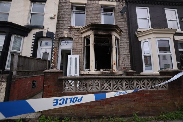 A police scene at a fire damaged house on Roxburgh Street