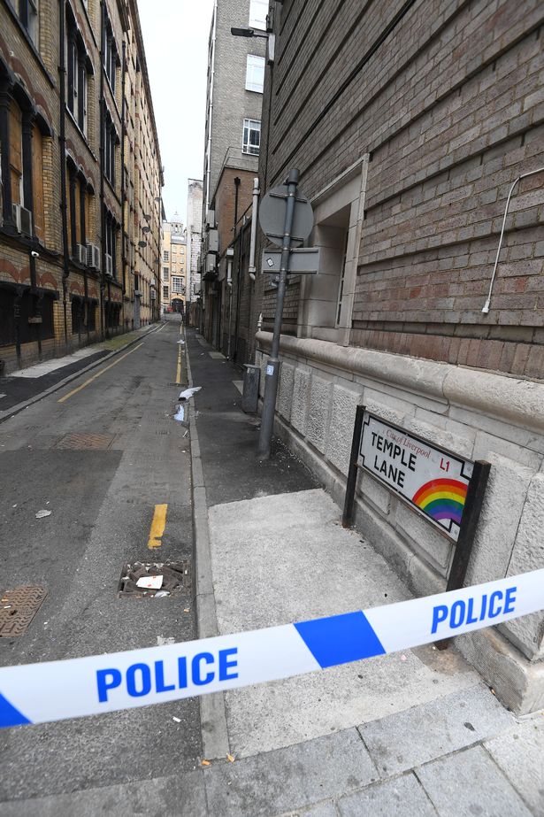 Police remain at the scene on Friday