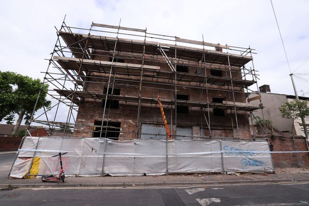 A derelict building, understood to be a former pub, has been cordoned off