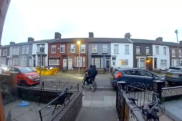 Two hooded men were seen circling Roxburgh Street in Walton before a house was set on fire 