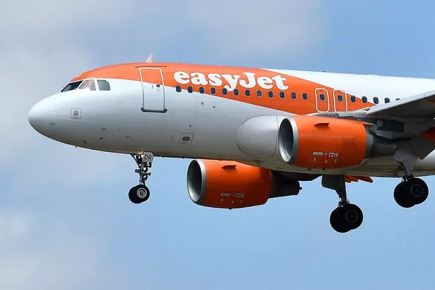 An Easyjet Airbus A319-111 aircraft lands at El Prat airport in Barcelona on July 1, 2022