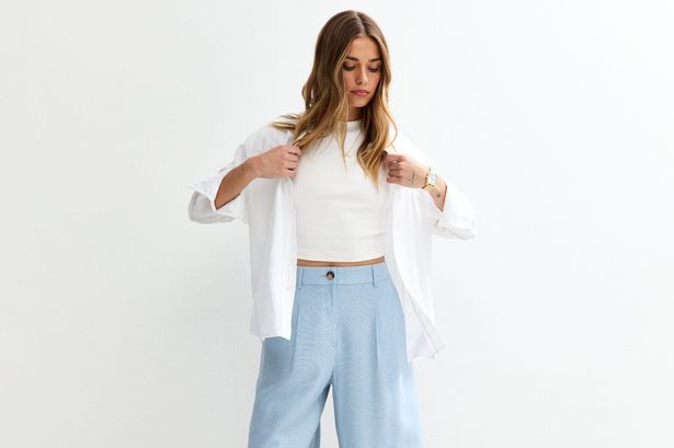 Woman wearing long blue shorts