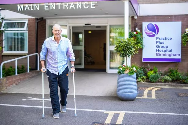 Dr Hilary Jones on crutches outside the hospital where he was treated.