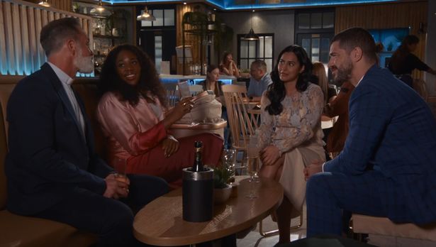 Daniel Brocklebank, Channique Sterling-Brown, Sair Khan and Sam Robertson sat together in a bar set for a scene on Coronation Street.