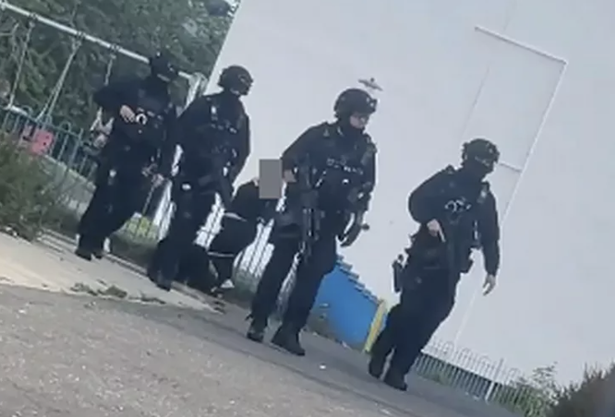 Armed police swarmed the area.