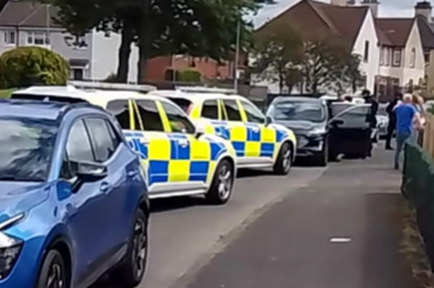Armed police at the scene on Monday afternoon