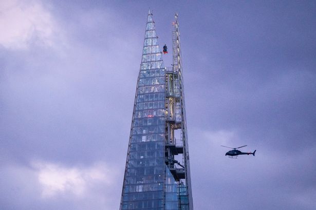 Superman soars above London as Daily Planet helicopters circle ​the skyscraper