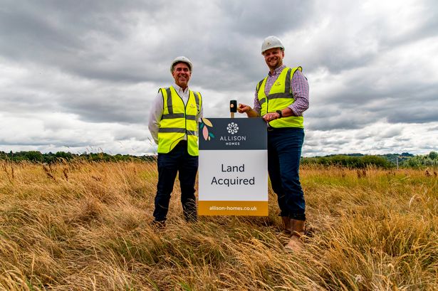Mike Gill, Project Director (left), and Andy Cattermole, Planning Director (right), of Allison Homes, pictured on site at Longmoor with land acquired sign.