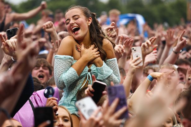 Music fans listen to Dylan John Thomas perform on day two of the TRNSMT Festival 2024 at Glasgow Green on July 13, 2024 in Glasgow, Scotland