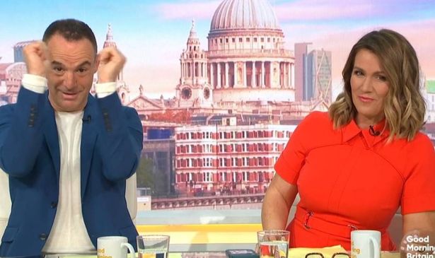 Martin Lewis holding his hands up next to Susanna Reid on GMB