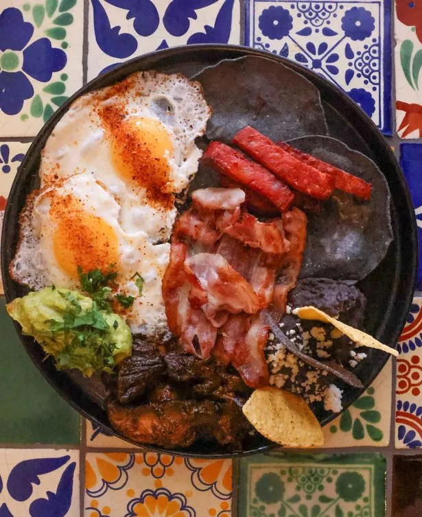 The "full Mexican" breakfast at Tocayo (fried egg, refried beans, asada mushrooms, avocado, chorizo, bacon, corn tortillas)   