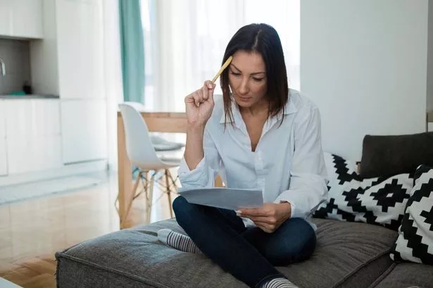 Worried woman reading document