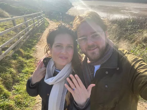 Dale and Ana standing outside on a countryside path