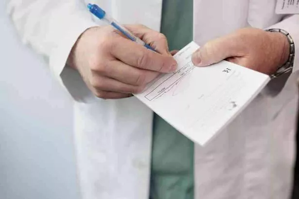 Generic GP doctor writing prescription