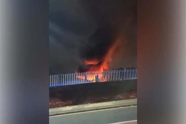 Flames soar from a fire in Swinton