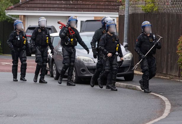 Some of the 75 officers who took part in the raids